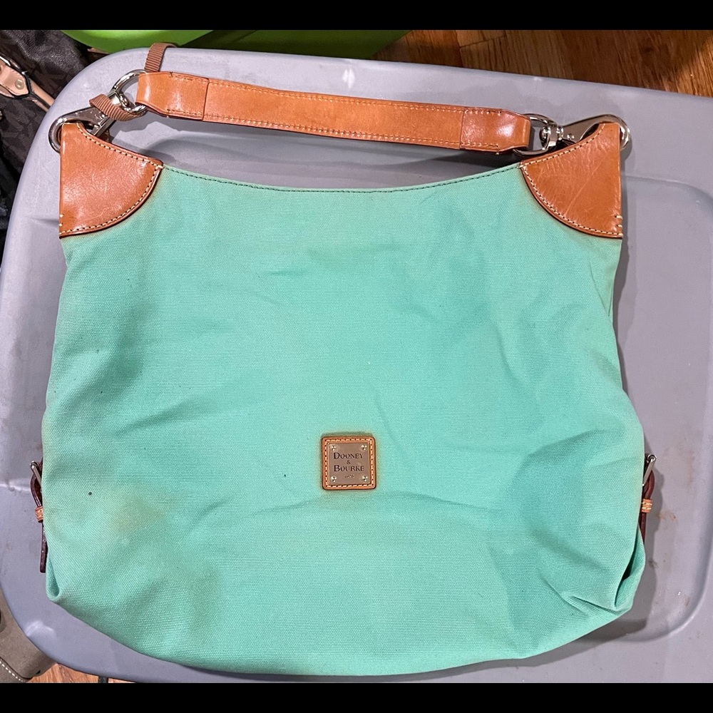 Dooney and Bourke. Bought from here. Good used condition.